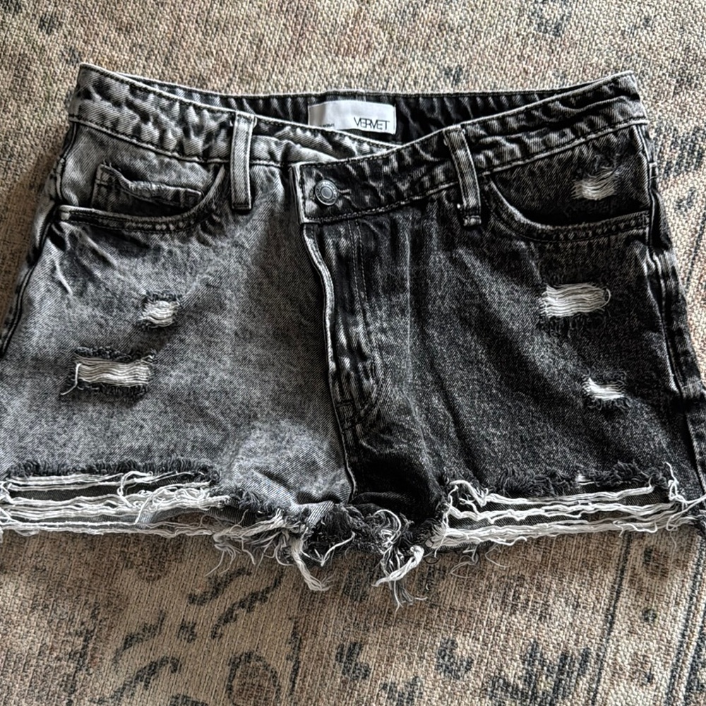 Vibrant Black Jean Shorts with Distressed Edge